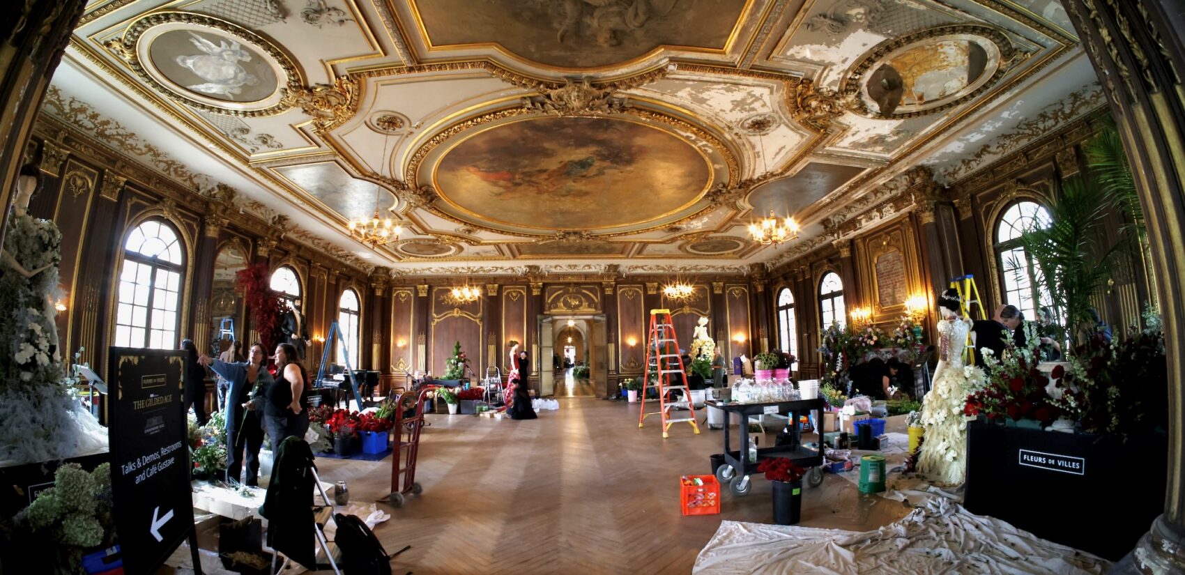 a team works on the new exhibit inside Lynnewood Hall