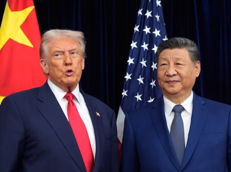 President Donald Trump, left, and Chinese President Xi Jinping pose together ahead of their summit talk at Gimhae International Airport in Busan, South Korea, Thursday, Oct. 30, 2025. (AP Photo/Mark Schiefelbein)