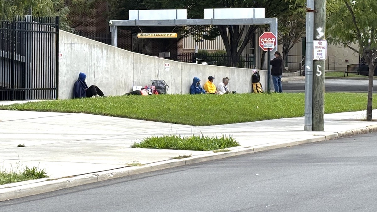 Homeless people sitting at an underpass in Wilminigton