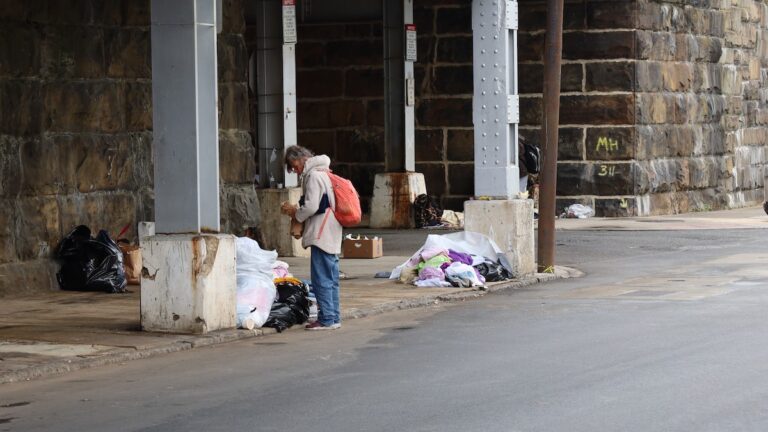 Homeless people sitting at an underpass in Wilminigton