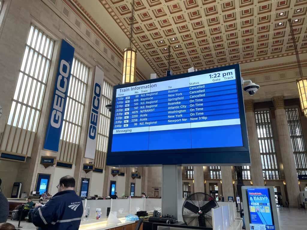 The board tracking Amtrak's train routes shows some cancellations during a nor'easter storm on September 26, 2026.