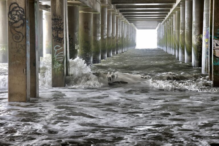 Waves crash against the pillars of Steel Pier in Atlantic City