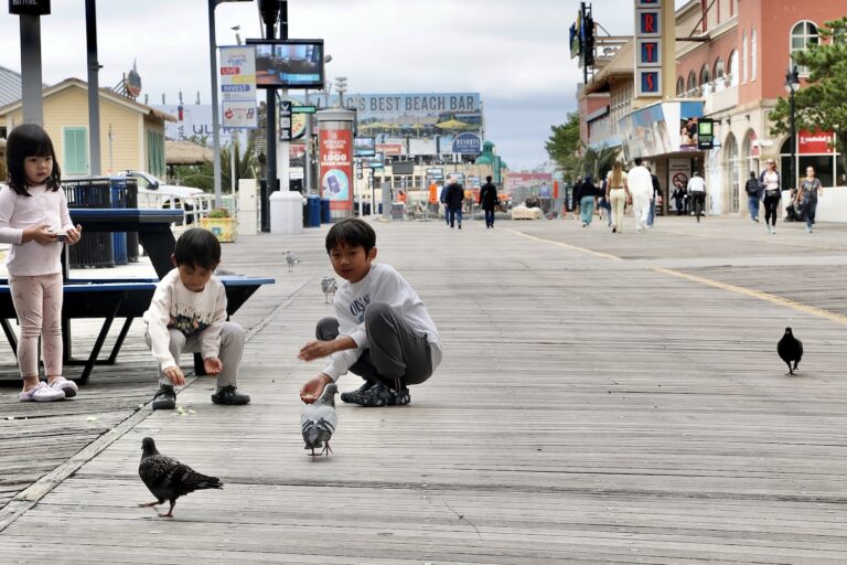 Children feed pigeons on the Boardwalk in Atlantic City