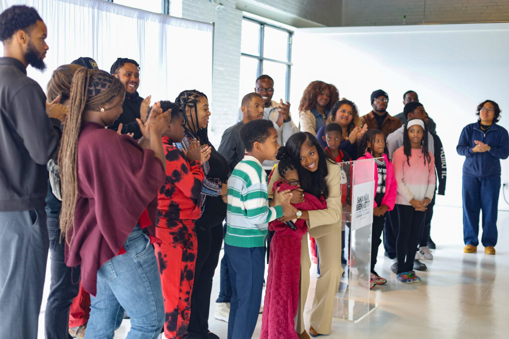 Shania Bennett embraces some young supporters during the press conference for the kickoff of her mayoral campaign in Philadelphia.