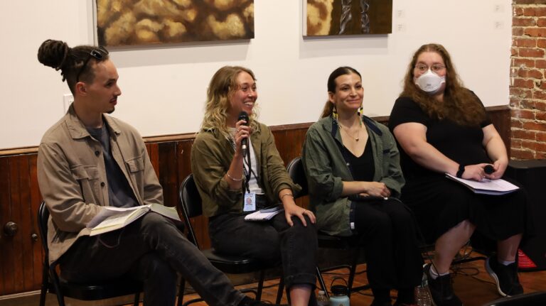 Bryce Cracknell, Sophia Schmidt, Katrina Janco and Kimberly Paynter sitting