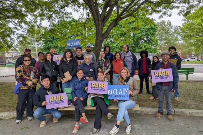 Reclaim Philadelphia members hold signs reading RABB for CONGRESS