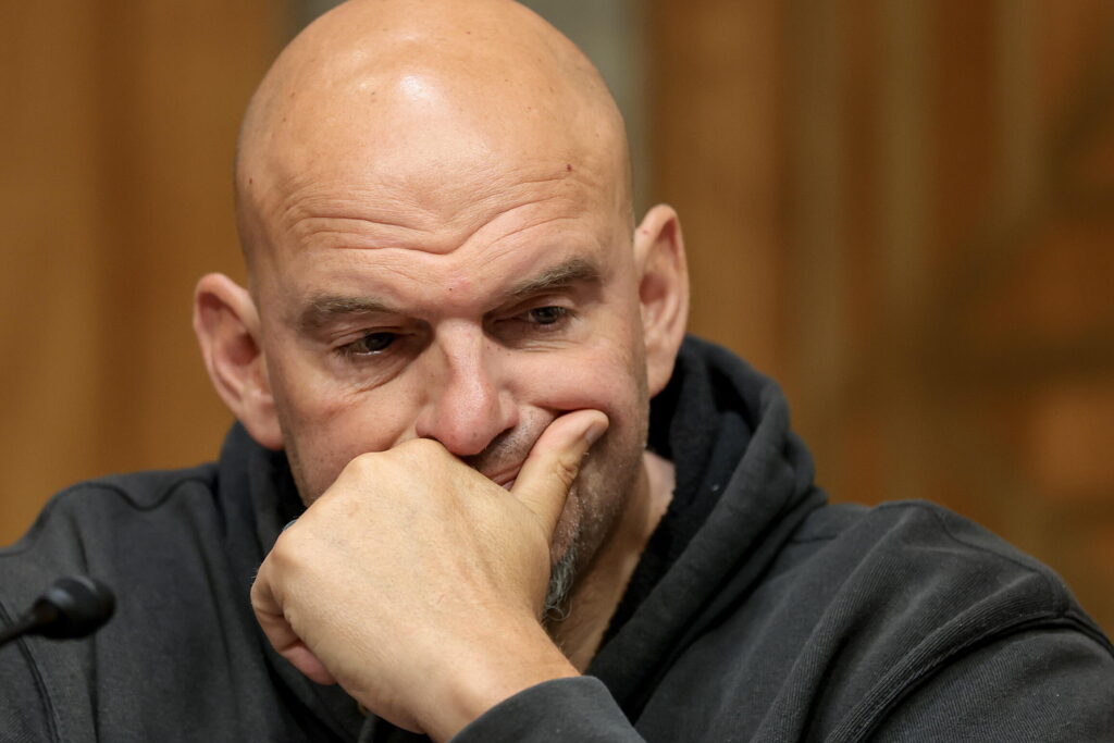 Senate Homeland Security And Gov’t Affairs Committee To Vote On Contempt Resolution Against Former NIAID Director Fauci Sen. John Fetterman (D-PA) looks on during a business meeting with the Senate Homeland Security And Government Affairs Committee in the Dirksen Senate Office Building on August 06, 2026. Fetterman's constituents in Pennsylvania told NPR they feel