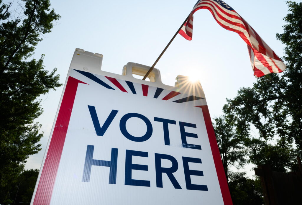 Signage directs voters at a polling place in White Bear Township, Minn., on Aug. 11.