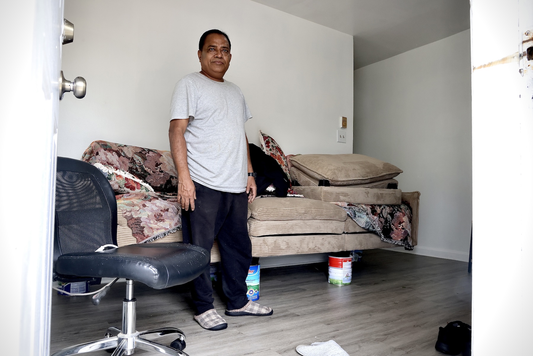 Kaji Alam used cans to raise the furniture above the floodwaters