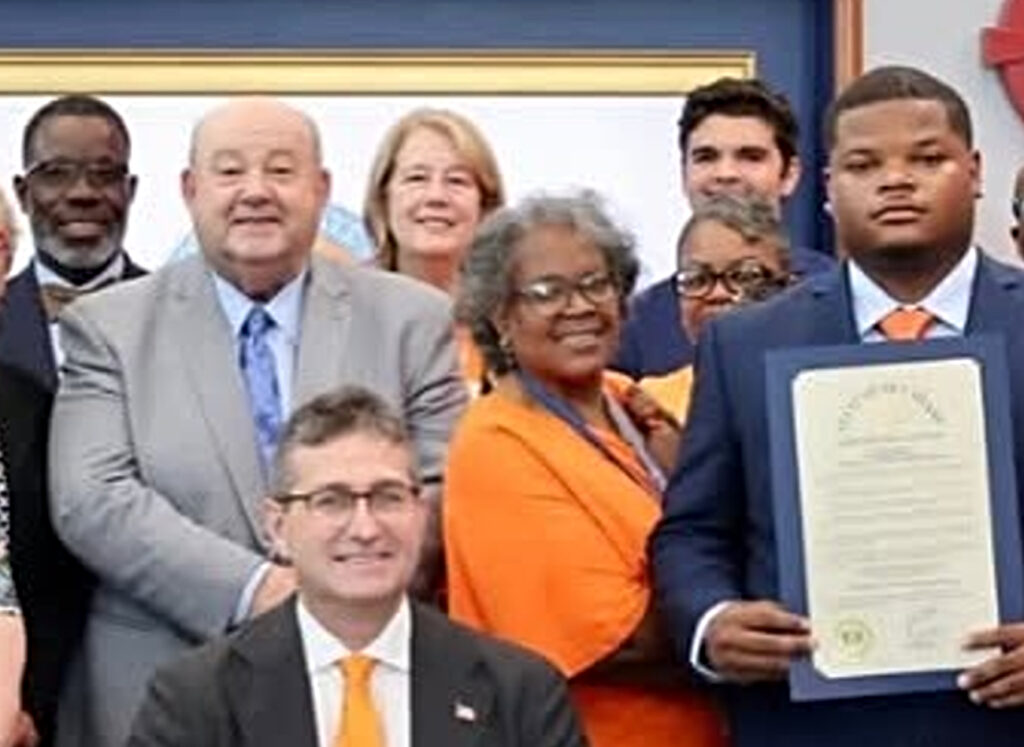 Matt Meyer next to Kaligah Parker and others