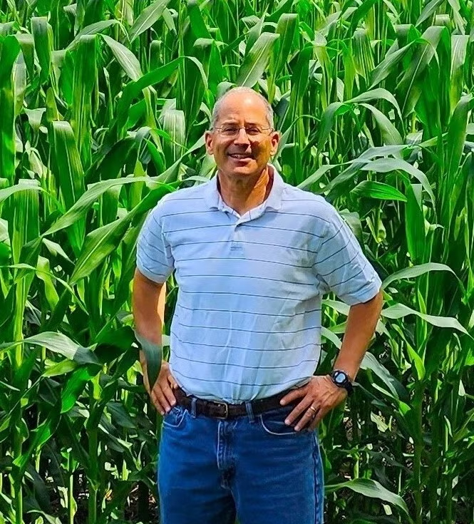 Dr. Mike Katz, the Republican candidate for Delaware’s U.S. Senate seat in 2026, stands in a cornfield with his hands on his hips