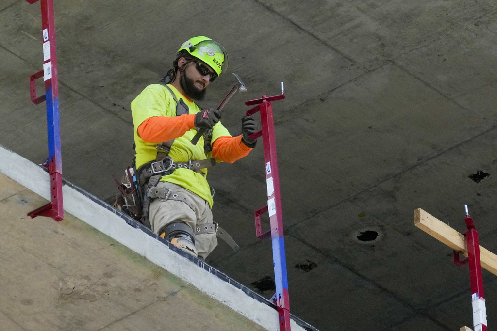 Job Openings A construction worker installs a safety railing on a new building in Philadelphia