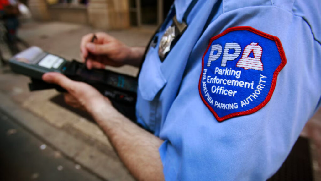 ppa-ap-photox1200-1-1-cropped A member of the Philadelphia Parking Authority writes a ticket