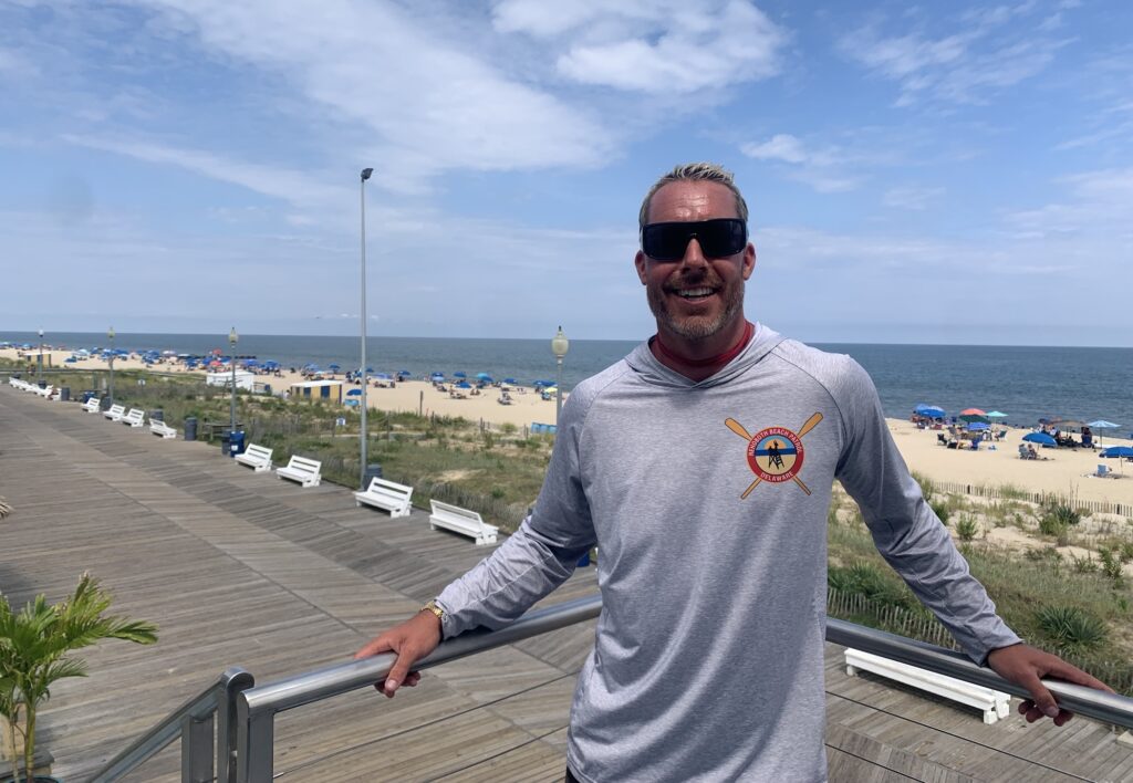 Ben Schweers stands on the boardwalk near the beach in Rehoboth Beach, Del.