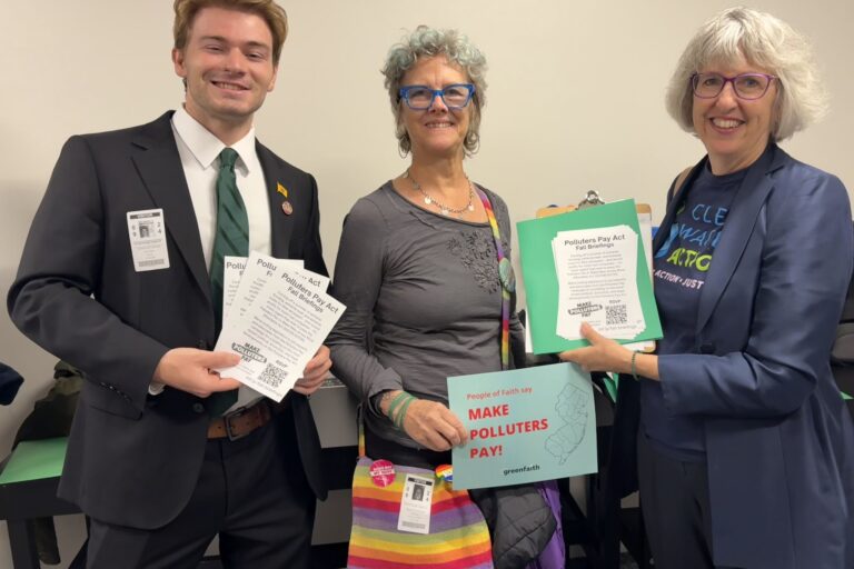 Three activists smile for a photo