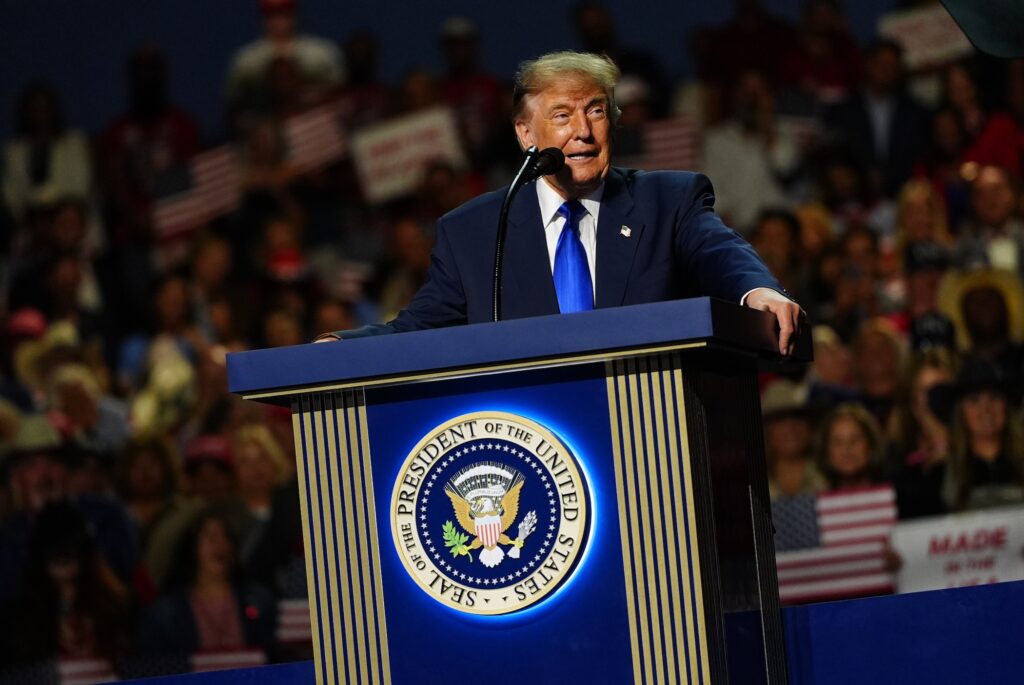 Election 2026 Republicans Donald Trump speaking at a podium on stage in Dallas.