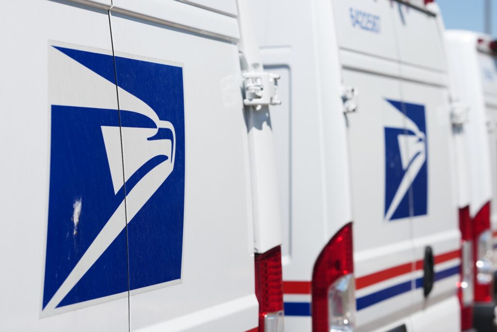 Election 2026 Postal Service Delivery vans are parked outside the main United States Postal Service headquarters in northeast Denver.