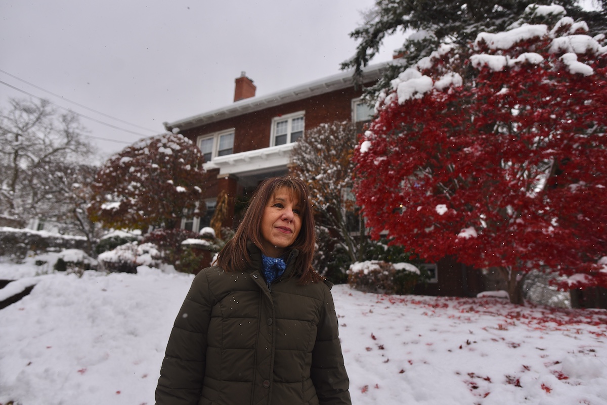 Anne Hardy, a retired emergency room nurse of Bradford Regional Medical Center, stands in front of her place of residence.