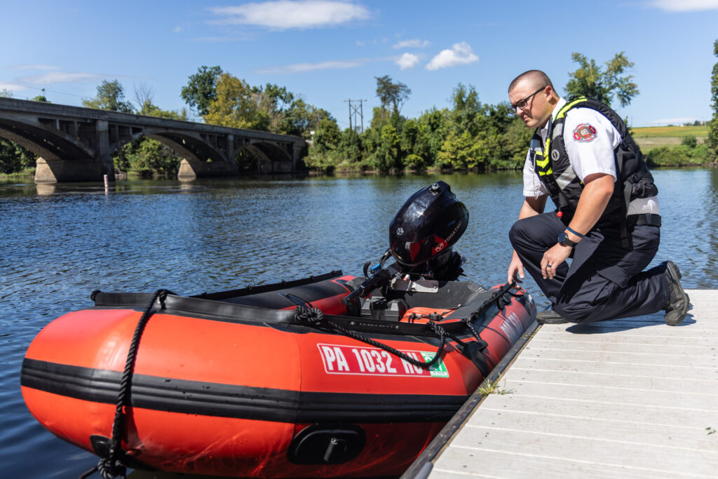 10 02 2026 k paynter water rescue demo west chester-3 Robert Rawley next to a rescue boat