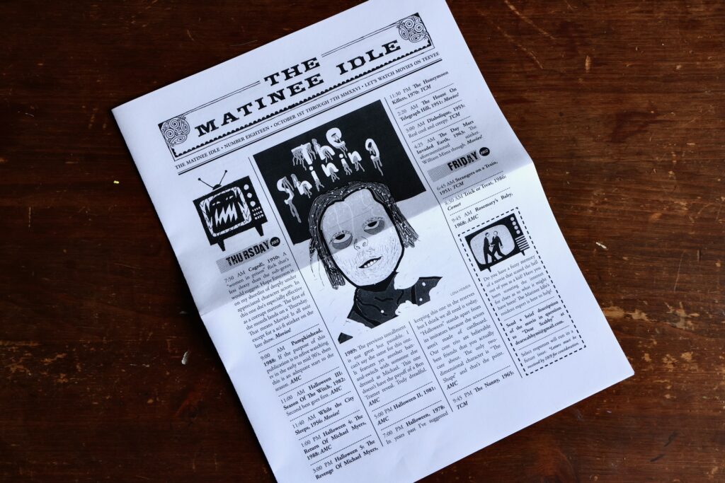 The front cover of an issue of 'The Matinee Idle' features a drawing of Jack Nicholson's character in the movie 'The Shining.'