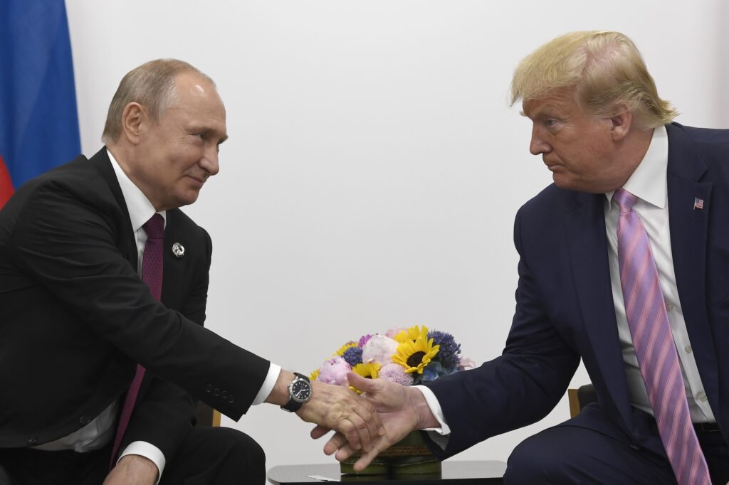 President Donald Trump, right, shakes hands with Russian President Vladimir Putin, left, during a bilateral meeting on the sidelines of the G-20 summit in Osaka, Japan, Friday, June 28, 2019. (AP Photo/Susan Walsh)