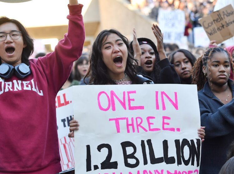 Demonstrators attend a protest against Cornell University's handling of the 2024 fraternity-house gang rape allegations at the campus, Monday, Oct. 5, 2026, in Ithaca, N.Y. (AP Photo/Adrian Kraus)