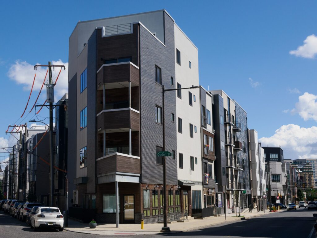 A towering mixed-use condominium now dominates the corner of Ridge Avenue and Ogden Street