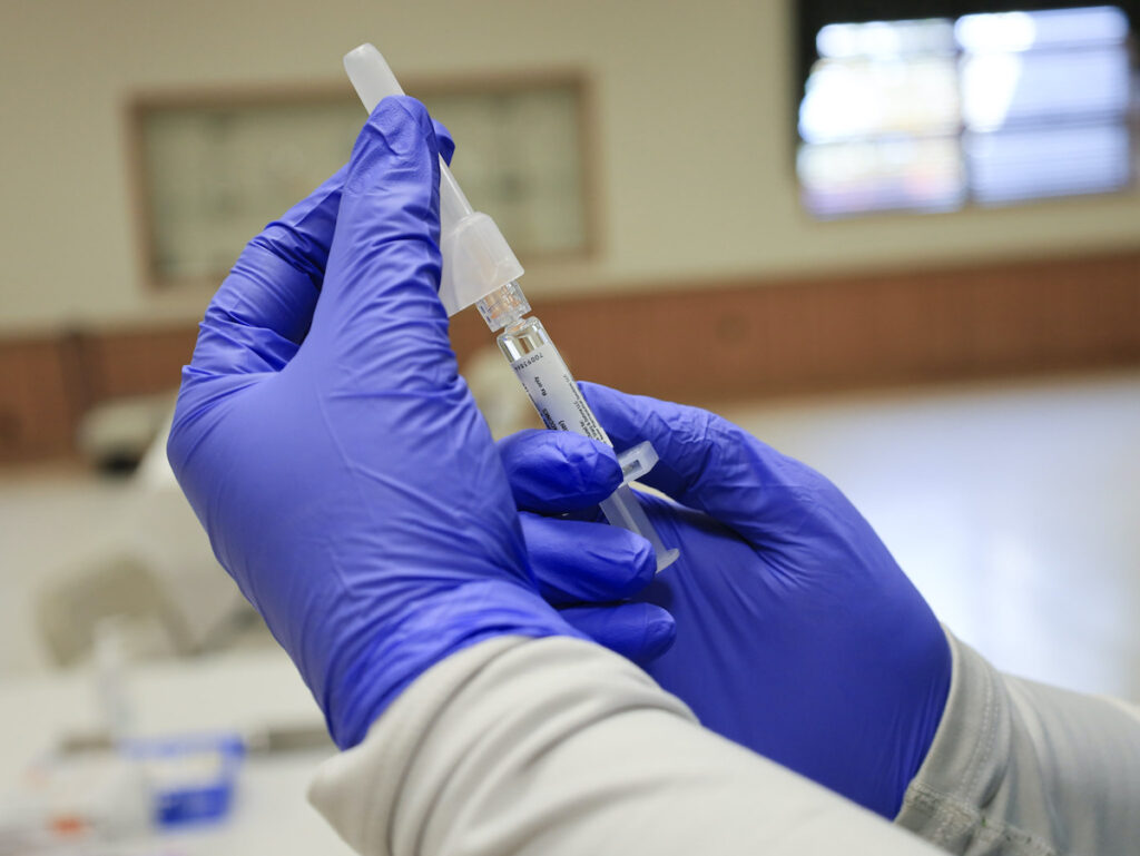 MRR vaccine being drawn into a needle