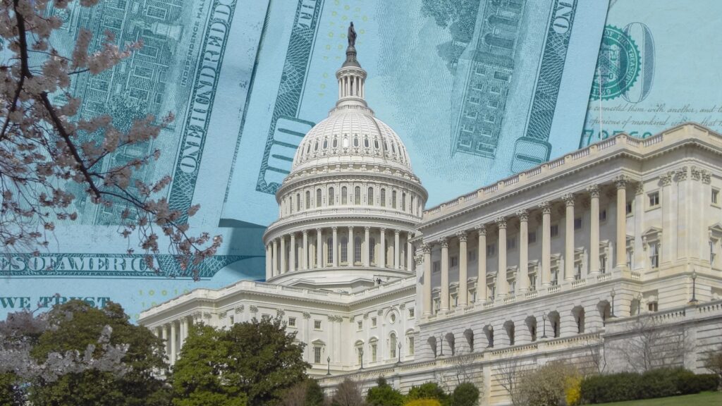 the U.S. Capitol building with a background of $100 bills