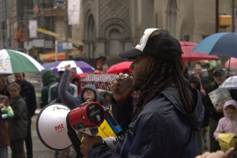 Jeffery Young speaks to rallygoers