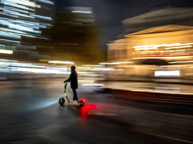 A man drives an E-scooter