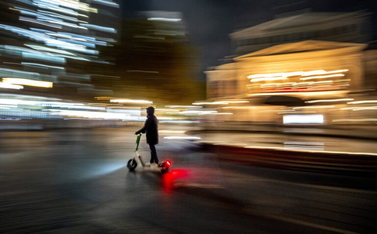 A man drives an E-scooter