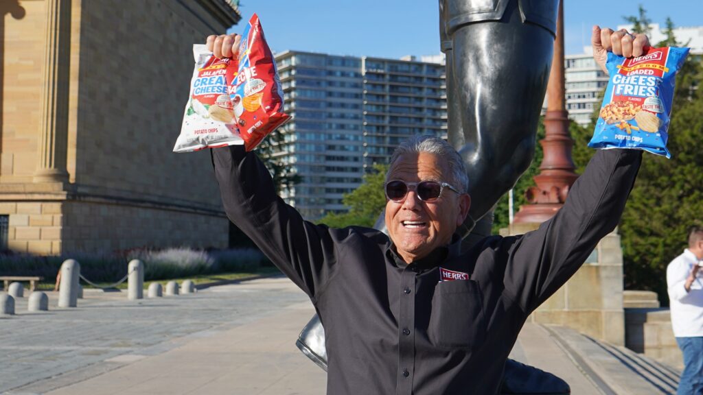 ed-herr-chips-bags-bp-101526 Ed Herr, executive chairman of Herr’s shows of the three new “Flavored by Philly: Taste of 250