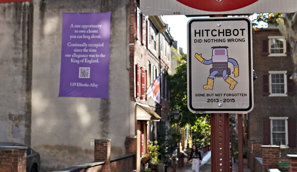 hitchbot-elfreths-alley-bp-100126 A sign commemorating hitchBOT in front of Elfreth's Alley in Old City