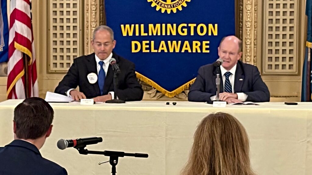 Michael Katz and Chris Coons at a debate