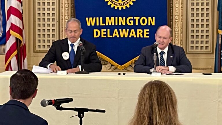 Michael Katz and Chris Coons at a debate