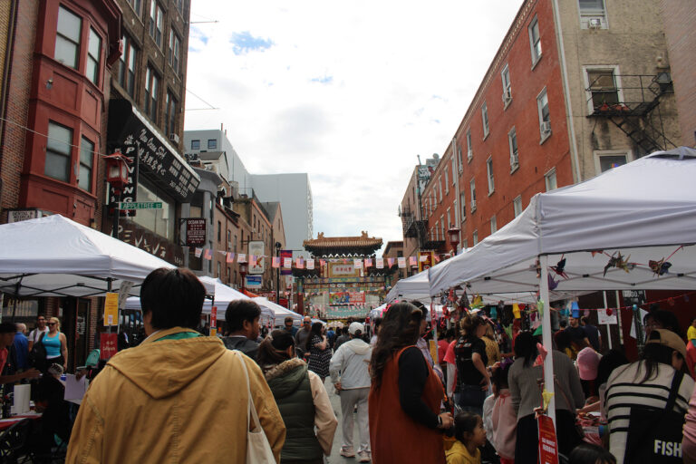 A large group of people in Philadelphia's Chinatown neighborhood