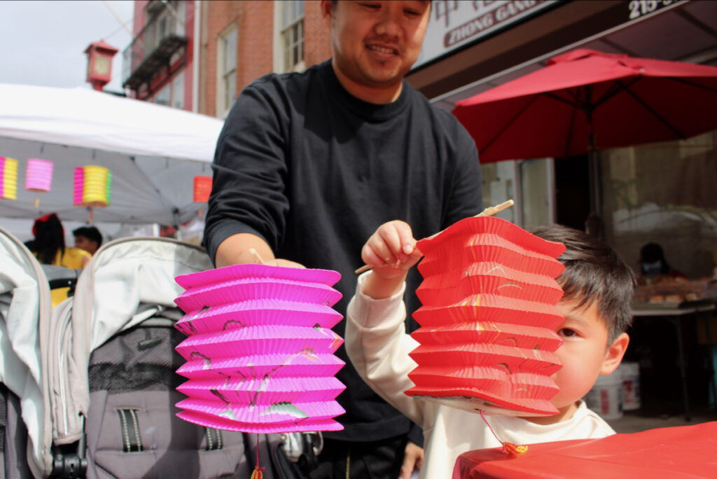 Alex Giang and his son show off Chinese lanterns