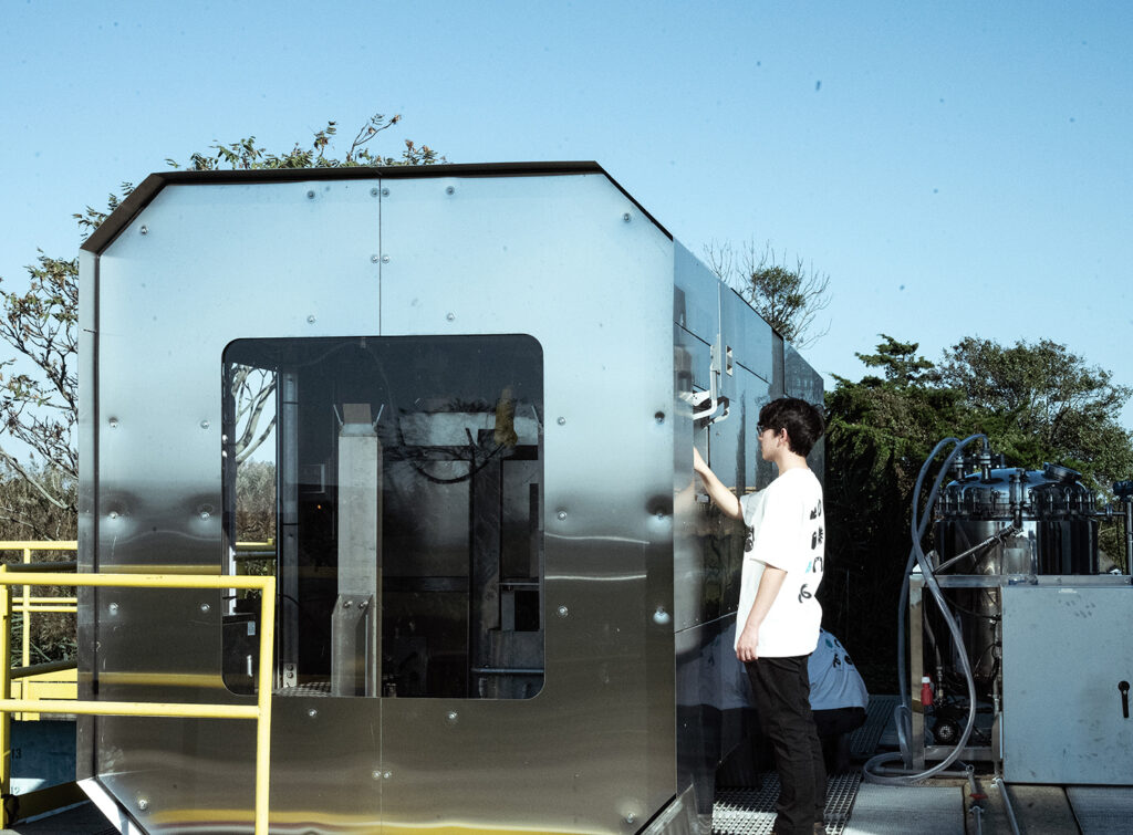 A man works with technology to remove microplastics from water