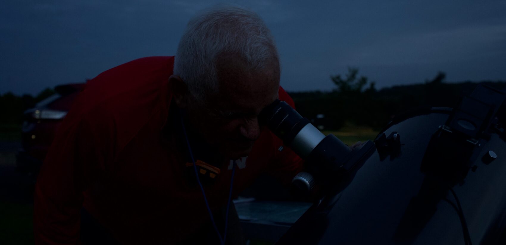 Bob Jorgenson looking into a telescope