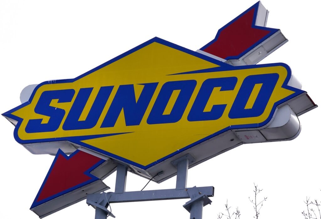 A Sunoco sign is visible outside a gas station